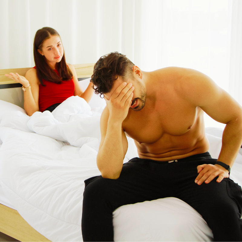 Couple in bed and man ashamed